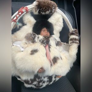 Vintage Native American Indian Baby in a Woven Basket with Rabbit Fur